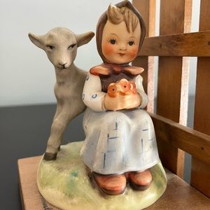 Adorable girl with goat Hummel